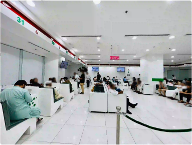 Bustling interior of Amer Center, Dubai, showing clients and

 staff during service hours.